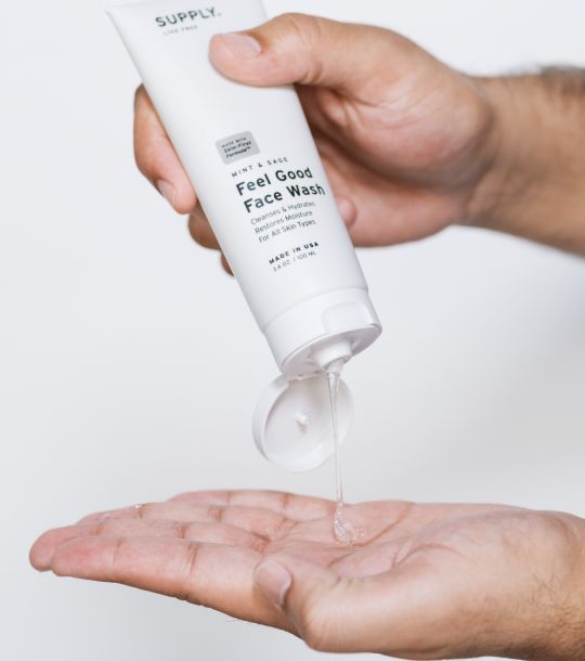 A pair of hands pouring the Razorloom Co face wash